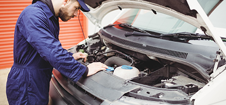 mechanic checking engine