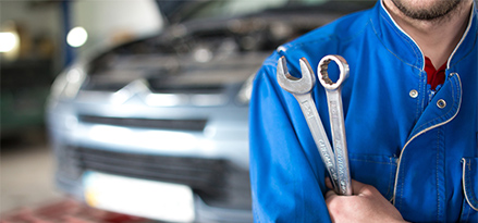 mechanic holding tools